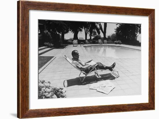 Richard Nixon Reading Newspapers While Sitting by the Pool in San Clemente, Ca. 1969-74-null-Framed Photo