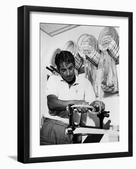 Richard 'Pancho' Gonzales Restringing a Tennis Racket in 1962-null-Framed Photo