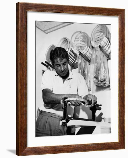 Richard 'Pancho' Gonzales Restringing a Tennis Racket in 1962-null-Framed Photo