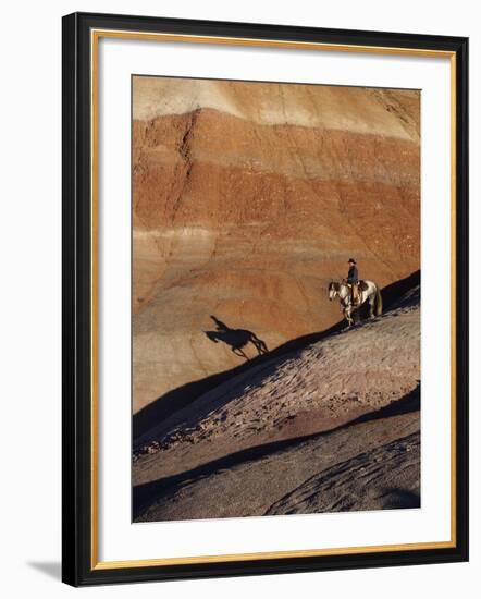 Rider with Shadow Coming down Hill in Painted Desert-Terry Eggers-Framed Photographic Print