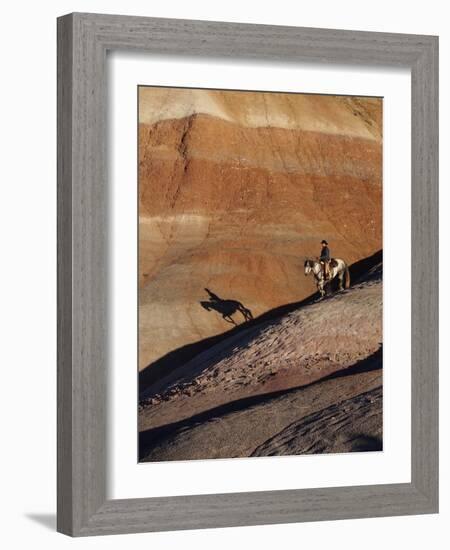 Rider with Shadow Coming down Hill in Painted Desert-Terry Eggers-Framed Photographic Print