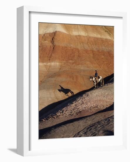 Rider with Shadow Coming down Hill in Painted Desert-Terry Eggers-Framed Photographic Print