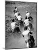 Riders Enjoying Motorcycle Racing, Leaving a Trail of Dust Behind-Loomis Dean-Mounted Photographic Print