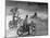 Riders Enjoying Motorcycle Riding, with One Taking a Spill-Loomis Dean-Mounted Photographic Print