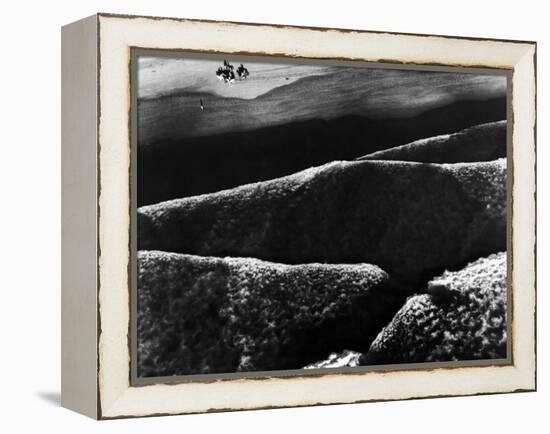 Riders Guiding their Horses Along the Shore as Mountainous Waves of High Tide Roll Shoreward-Margaret Bourke-White-Framed Premier Image Canvas