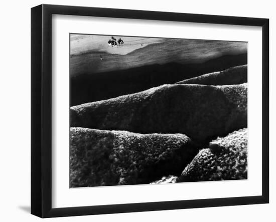Riders Guiding their Horses Along the Shore as Mountainous Waves of High Tide Roll Shoreward-Margaret Bourke-White-Framed Photographic Print