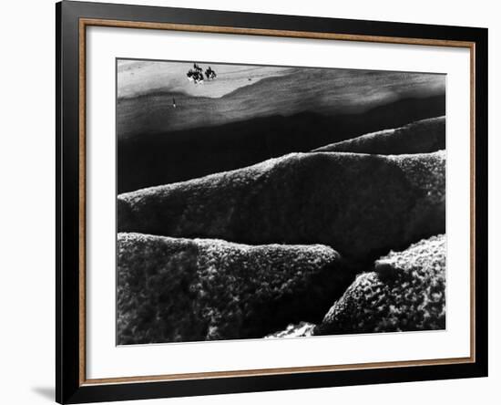 Riders Guiding their Horses Along the Shore as Mountainous Waves of High Tide Roll Shoreward-Margaret Bourke-White-Framed Photographic Print