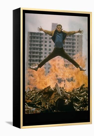 Riff Leaps over Smoldering Rubble of New York Slum Clearance Project in Scene from West Side Story-Gjon Mili-Framed Premier Image Canvas