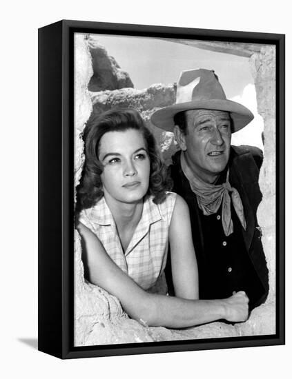 RIO BRAVO, 1959 directed by HOWARD HAWKS On the set, Angie Dickinson and John Wayne (b/w photo)-null-Framed Stretched Canvas