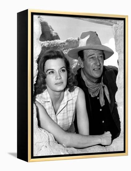 RIO BRAVO, 1959 directed by HOWARD HAWKS On the set, Angie Dickinson and John Wayne (b/w photo)-null-Framed Stretched Canvas