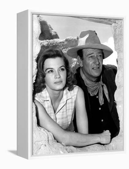 RIO BRAVO, 1959 directed by HOWARD HAWKS On the set, Angie Dickinson and John Wayne (b/w photo)-null-Framed Stretched Canvas