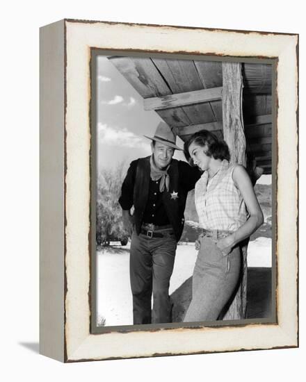 RIO BRAVO, 1959 directed by HOWARD HAWKS On the set, John Wayne and Angie Dickinson (b/w photo)-null-Framed Stretched Canvas