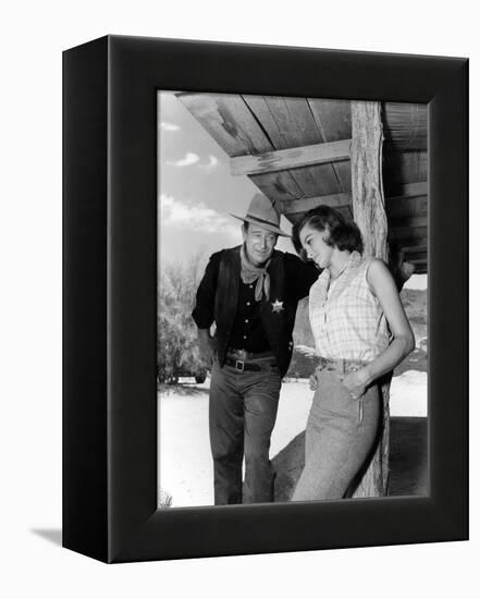 RIO BRAVO, 1959 directed by HOWARD HAWKS On the set, John Wayne and Angie Dickinson (b/w photo)-null-Framed Stretched Canvas