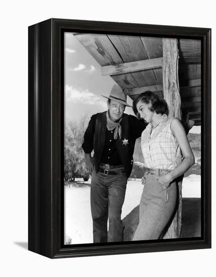 RIO BRAVO, 1959 directed by HOWARD HAWKS On the set, John Wayne and Angie Dickinson (b/w photo)-null-Framed Stretched Canvas