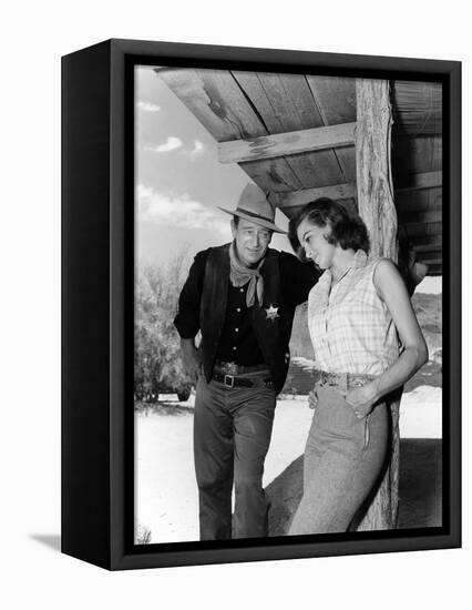 RIO BRAVO, 1959 directed by HOWARD HAWKS On the set, John Wayne and Angie Dickinson (b/w photo)-null-Framed Stretched Canvas