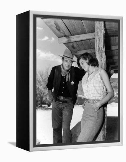 RIO BRAVO, 1959 directed by HOWARD HAWKS On the set, John Wayne and Angie Dickinson (b/w photo)-null-Framed Stretched Canvas