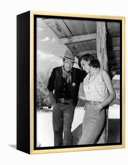 RIO BRAVO, 1959 directed by HOWARD HAWKS On the set, John Wayne and Angie Dickinson (b/w photo)-null-Framed Stretched Canvas