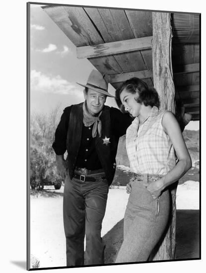 RIO BRAVO, 1959 directed by HOWARD HAWKS On the set, John Wayne and Angie Dickinson (b/w photo)-null-Mounted Photo