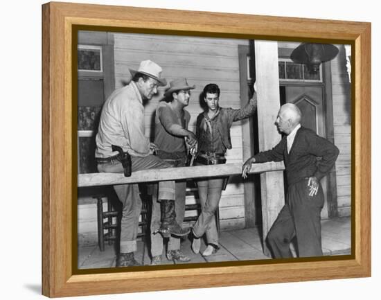 RIO BRAVO, 1959 directed by HOWARD HAWKS On the set, John Wayne, Dean Martin and Ricky Nelson with -null-Framed Stretched Canvas