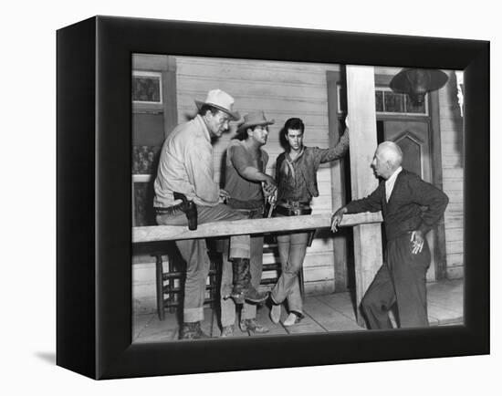 RIO BRAVO, 1959 directed by HOWARD HAWKS On the set, John Wayne, Dean Martin and Ricky Nelson with -null-Framed Stretched Canvas