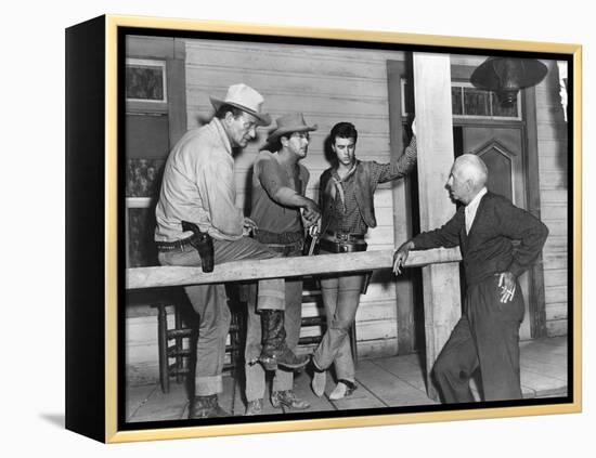 RIO BRAVO, 1959 directed by HOWARD HAWKS On the set, John Wayne, Dean Martin and Ricky Nelson with -null-Framed Stretched Canvas