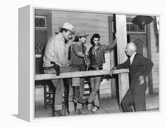 RIO BRAVO, 1959 directed by HOWARD HAWKS On the set, John Wayne, Dean Martin and Ricky Nelson with -null-Framed Stretched Canvas