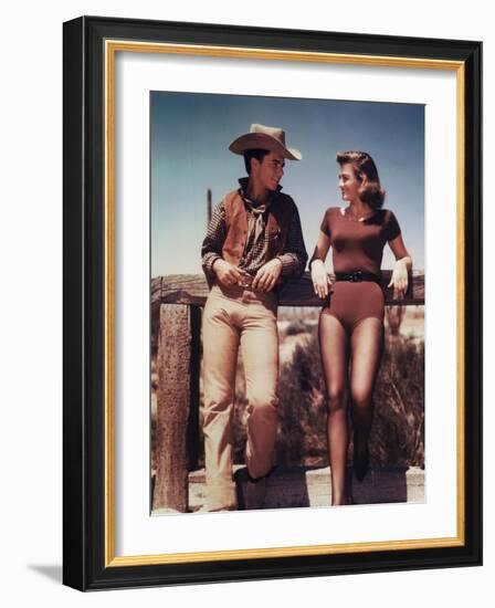 RIO BRAVO, 1959 directed by HOWARD HAWKS On the set, Ricky Nelson and Angie Dickinson (photo)-null-Framed Photo