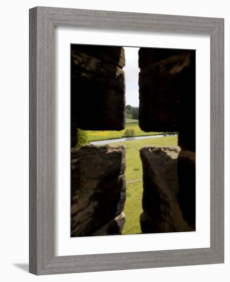 River Aln Seen Through Arrow Slit of Walls of Alnwick Castle, Northumberland, England-Nick Servian-Framed Photographic Print