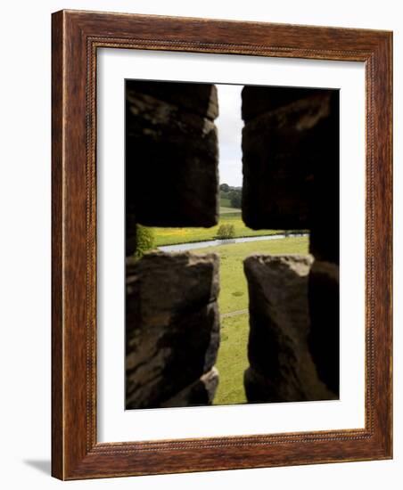 River Aln Seen Through Arrow Slit of Walls of Alnwick Castle, Northumberland, England-Nick Servian-Framed Photographic Print
