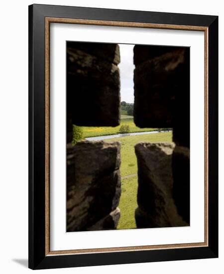 River Aln Seen Through Arrow Slit of Walls of Alnwick Castle, Northumberland, England-Nick Servian-Framed Photographic Print