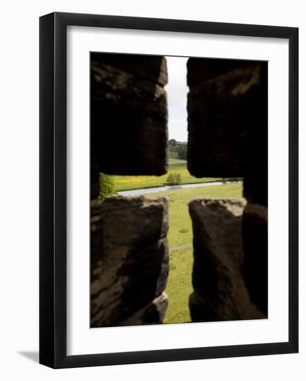 River Aln Seen Through Arrow Slit of Walls of Alnwick Castle, Northumberland, England-Nick Servian-Framed Photographic Print