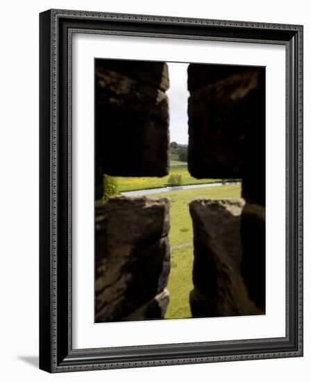 River Aln Seen Through Arrow Slit of Walls of Alnwick Castle, Northumberland, England-Nick Servian-Framed Photographic Print