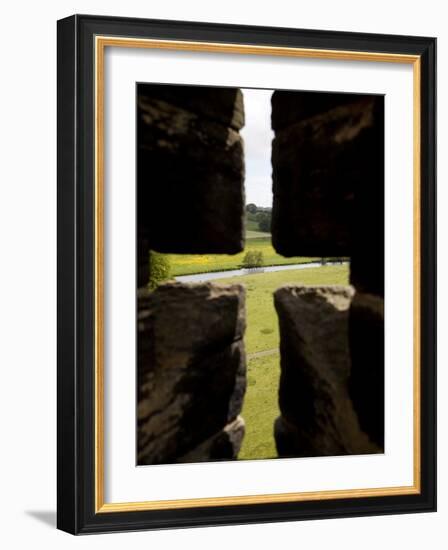 River Aln Seen Through Arrow Slit of Walls of Alnwick Castle, Northumberland, England-Nick Servian-Framed Photographic Print