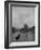 River Barge Churning up the Seine Past Notre Dame Cathedral on a Gloomy Winter Day-Ed Clark-Framed Photographic Print