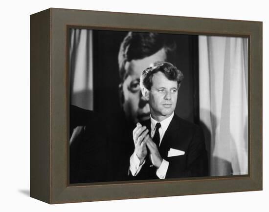 Robert F. Kennedy Campaigning in Front of Poster Portrait of His Brother President John F. Kennedy-Bill Eppridge-Framed Premier Image Canvas