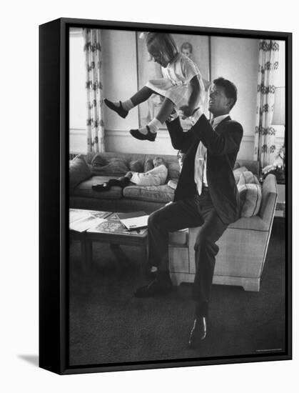 Robert F. Kennedy Playfully Tossing His Daughter Mary Kerry Kennedy Into the Air-John Dominis-Framed Premier Image Canvas