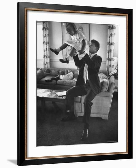 Robert F. Kennedy Playfully Tossing His Daughter Mary Kerry Kennedy Into the Air-John Dominis-Framed Premium Photographic Print