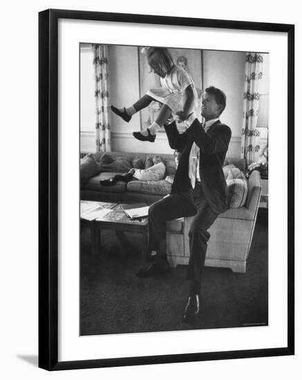 Robert F. Kennedy Playfully Tossing His Daughter Mary Kerry Kennedy Into the Air-John Dominis-Framed Premium Photographic Print