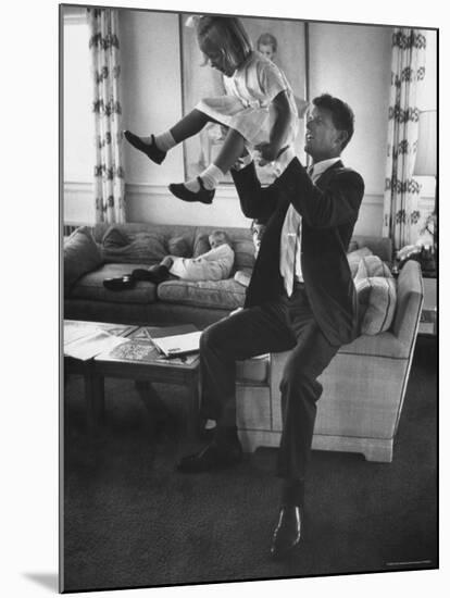 Robert F. Kennedy Playfully Tossing His Daughter Mary Kerry Kennedy Into the Air-John Dominis-Mounted Premium Photographic Print