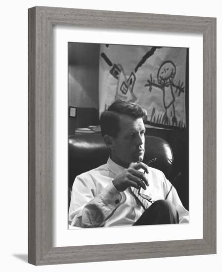 Robert F. Kennedy Sitting in Office in Front of Child's Painting-null-Framed Photographic Print