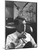 Robert F. Kennedy Sitting in Office in Front of Child's Painting-null-Mounted Photographic Print