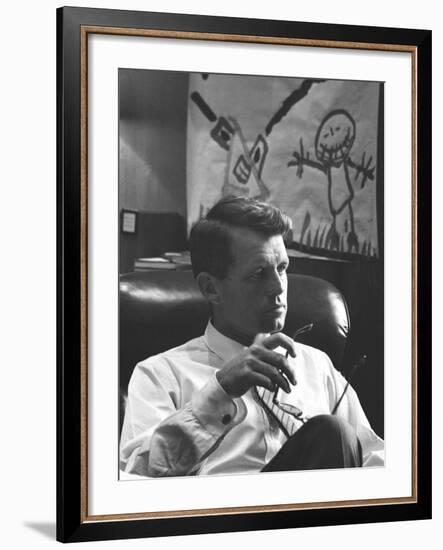 Robert F. Kennedy Sitting in Office in Front of Child's Painting-null-Framed Photographic Print