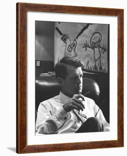 Robert F. Kennedy Sitting in Office in Front of Child's Painting-null-Framed Photographic Print