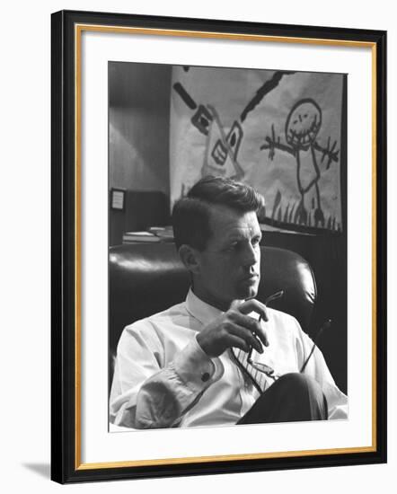 Robert F. Kennedy Sitting in Office in Front of Child's Painting-null-Framed Photographic Print