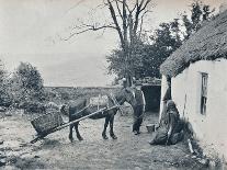 Grinding Grain in a Quern, Inishmurray, County Sligo, 1900-Robert John Welch-Framed Giclee Print