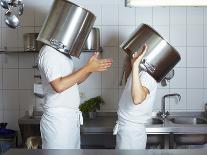 Two Chefs Having Discussion with Large Pans on their Heads-Robert Kneschke-Photographic Print