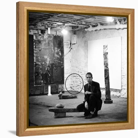 Robert Rauschenberg Sitting on His Sculpture in Studio, Among Other Paintings and Sculptures-Allan Grant-Framed Premier Image Canvas