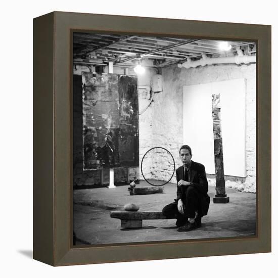 Robert Rauschenberg Sitting on His Sculpture in Studio, Among Other Paintings and Sculptures-Allan Grant-Framed Premier Image Canvas