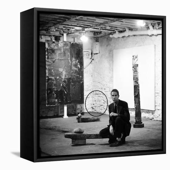 Robert Rauschenberg Sitting on His Sculpture in Studio, Among Other Paintings and Sculptures-Allan Grant-Framed Premier Image Canvas