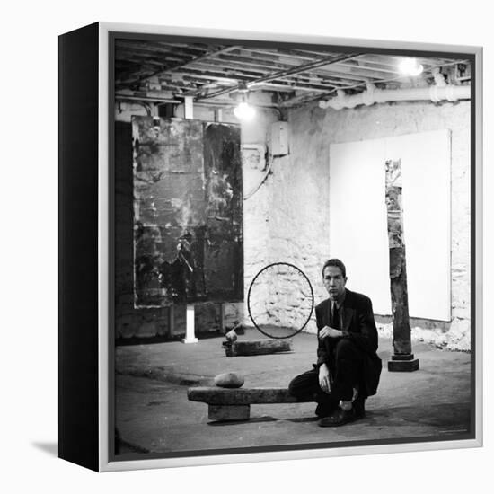 Robert Rauschenberg Sitting on His Sculpture in Studio, Among Other Paintings and Sculptures-Allan Grant-Framed Premier Image Canvas